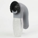 Rasoir anti-bouloche électrique gris avec poignée ergonomique et réservoir transparent pour l'entretien des vêtements et tissus.